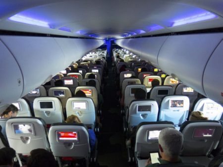 Airplane cabin, seats and passengers