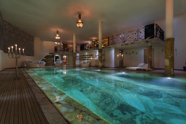 La Truffe Blanche, Verbier Credit La Truffe Blanche Image from internet - for Nikki http://www.bestchaletintheworld.com/interiors Located in Verbier atop the Swiss Alps is the perfect resort for indulging and relaxing. The magnificent 7 suite and 2 superior room and the spa occupies over 3,000 sqm of opulence and sleeps up to 20 people: 9 fireplaces , heated hard wood floors, Italian wall cover silks, exotic art deco French library, top of the line cinema room, a private discothèque, marble baths, onyx pool and a wine cellar with underwater windows to watch the swimmers as you sip French wine, bottled especially for the grants an atmosphere suited for queens and kings